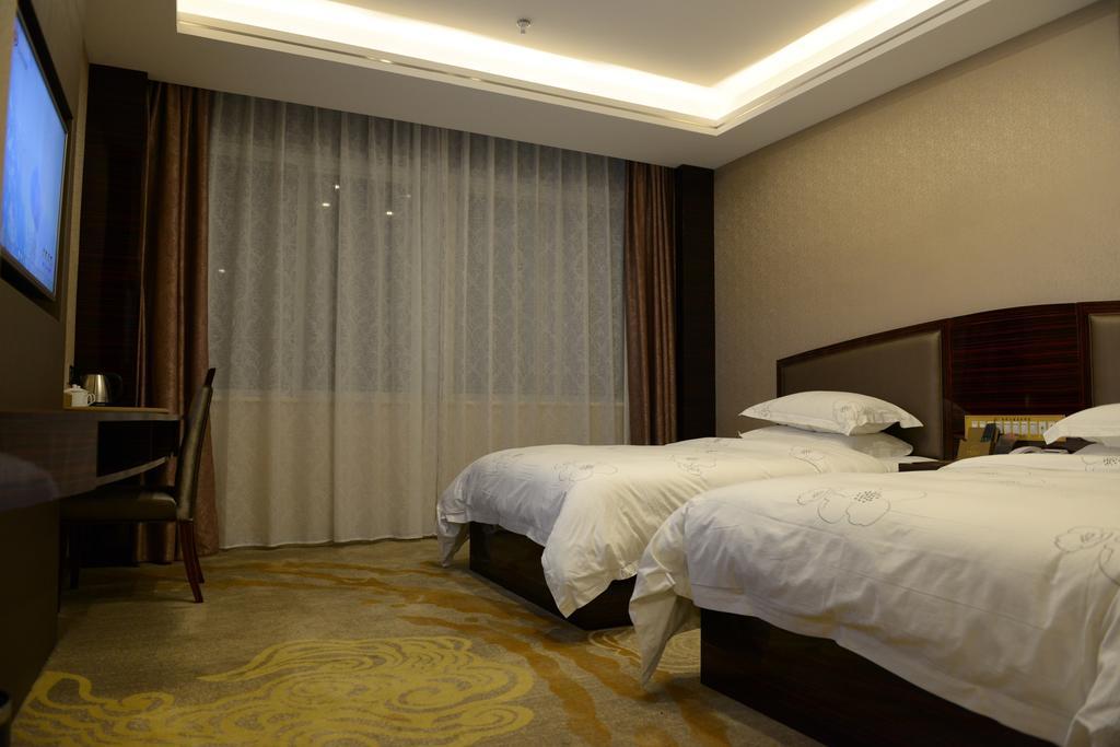 Tie Cheng Hotel Cantón Habitación foto